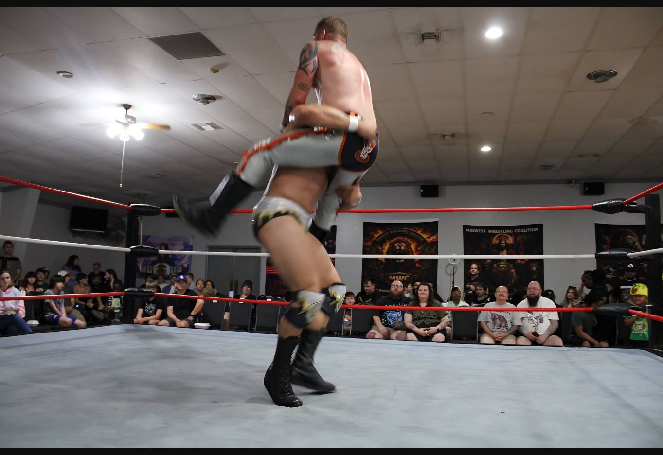 Joey O'Riley lifting Matty Ice during their MWC World Championship match