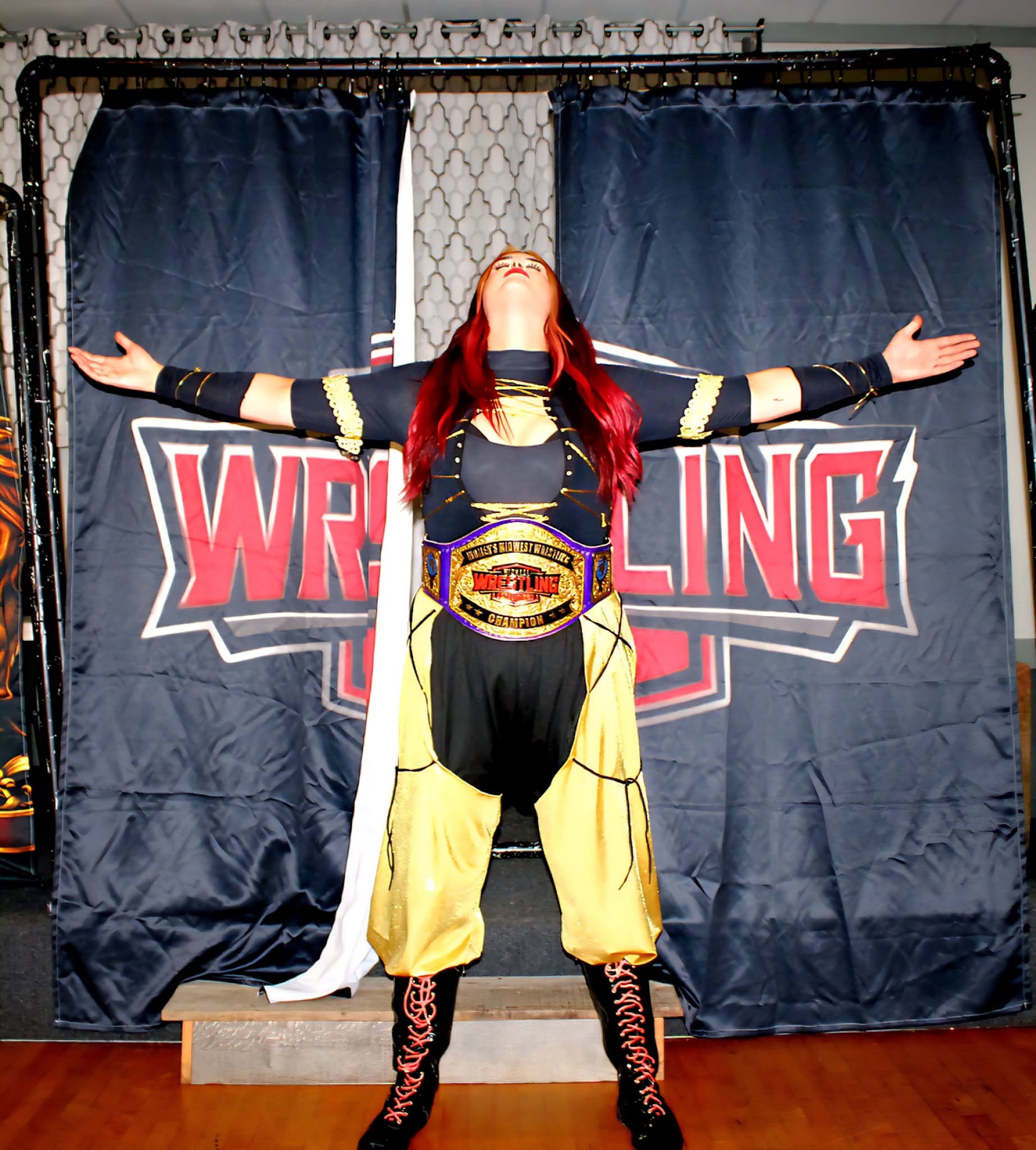 Lillith Khan posing with the MWC Women's Championship