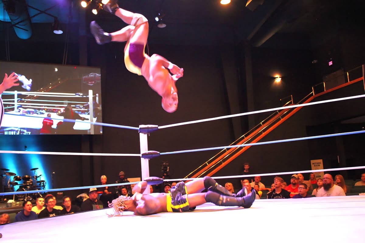 The Rocket launches into a moonsault.