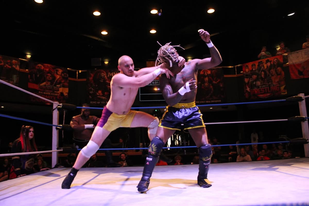Luke Anthony locks up with his opponent.